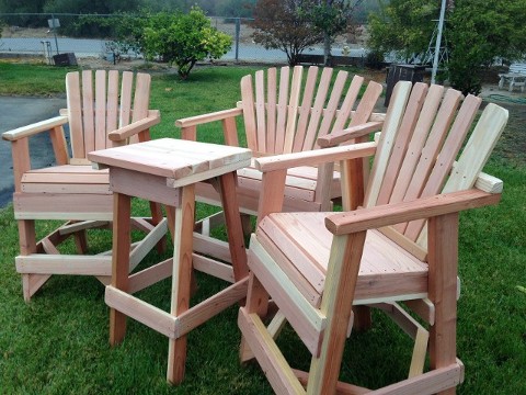 Bistro / Balcony Set Chairs and table are solid Redwood and are unfinished. The elevated height design make them perfect for an elevated view over an existing railing or obstacle.